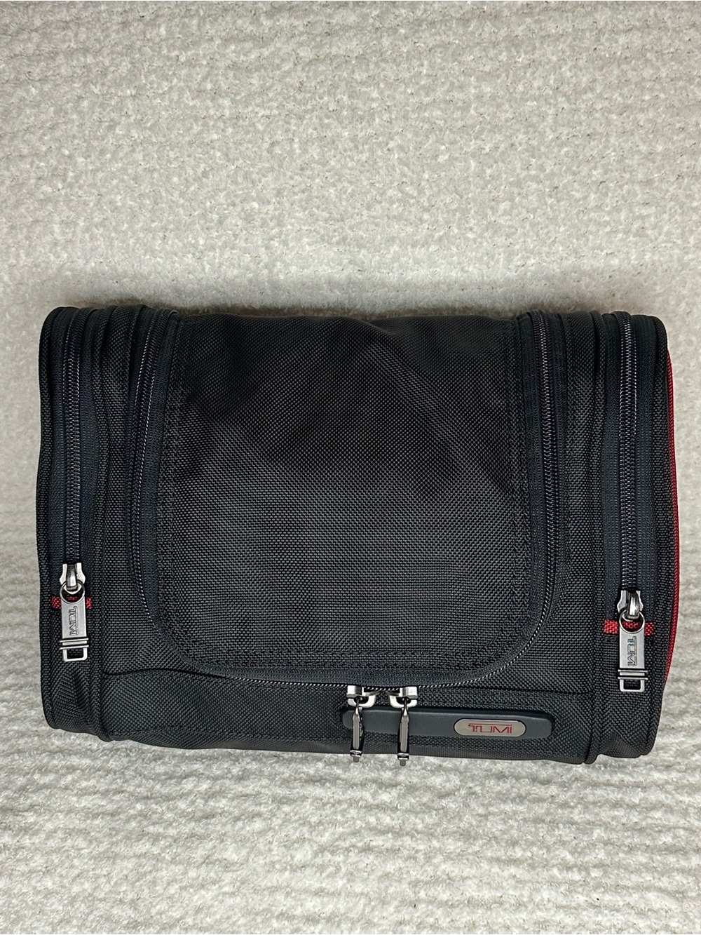 Tumi Black Toiletry Bag with Red Accents